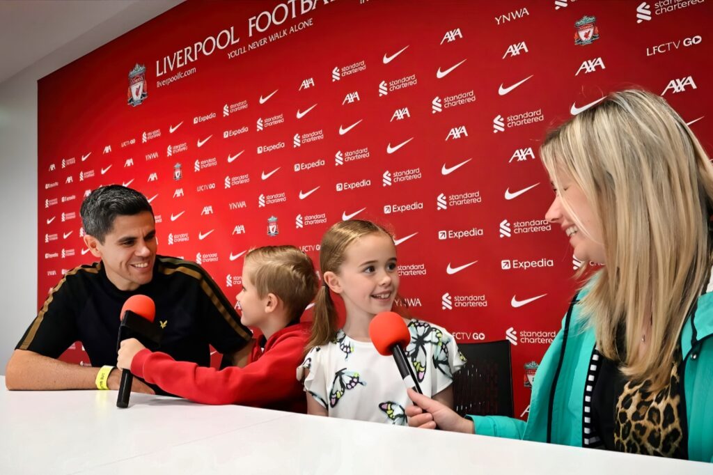 Family Tour of Anfield Stadium - Press Room Anfield Stadium Press Room - Family of 4